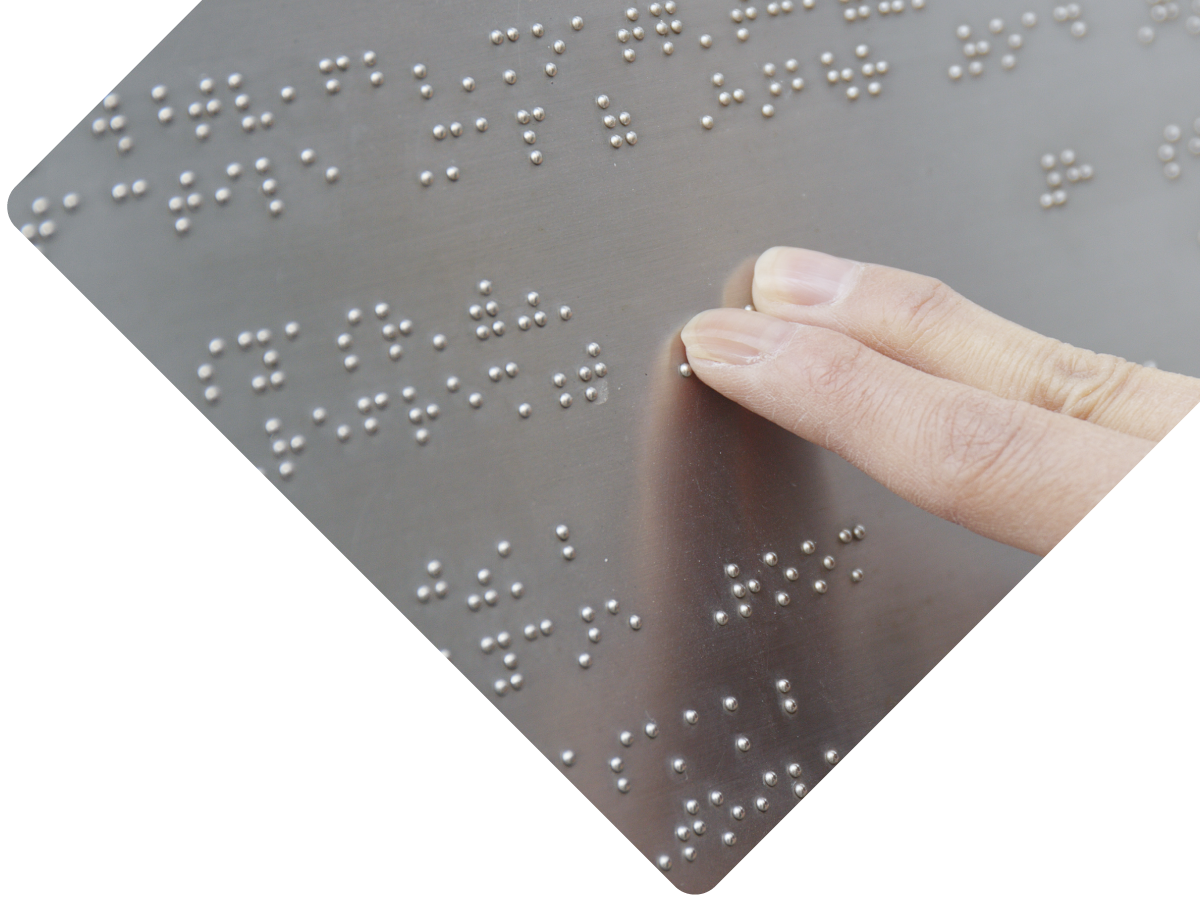 Hand reading braille